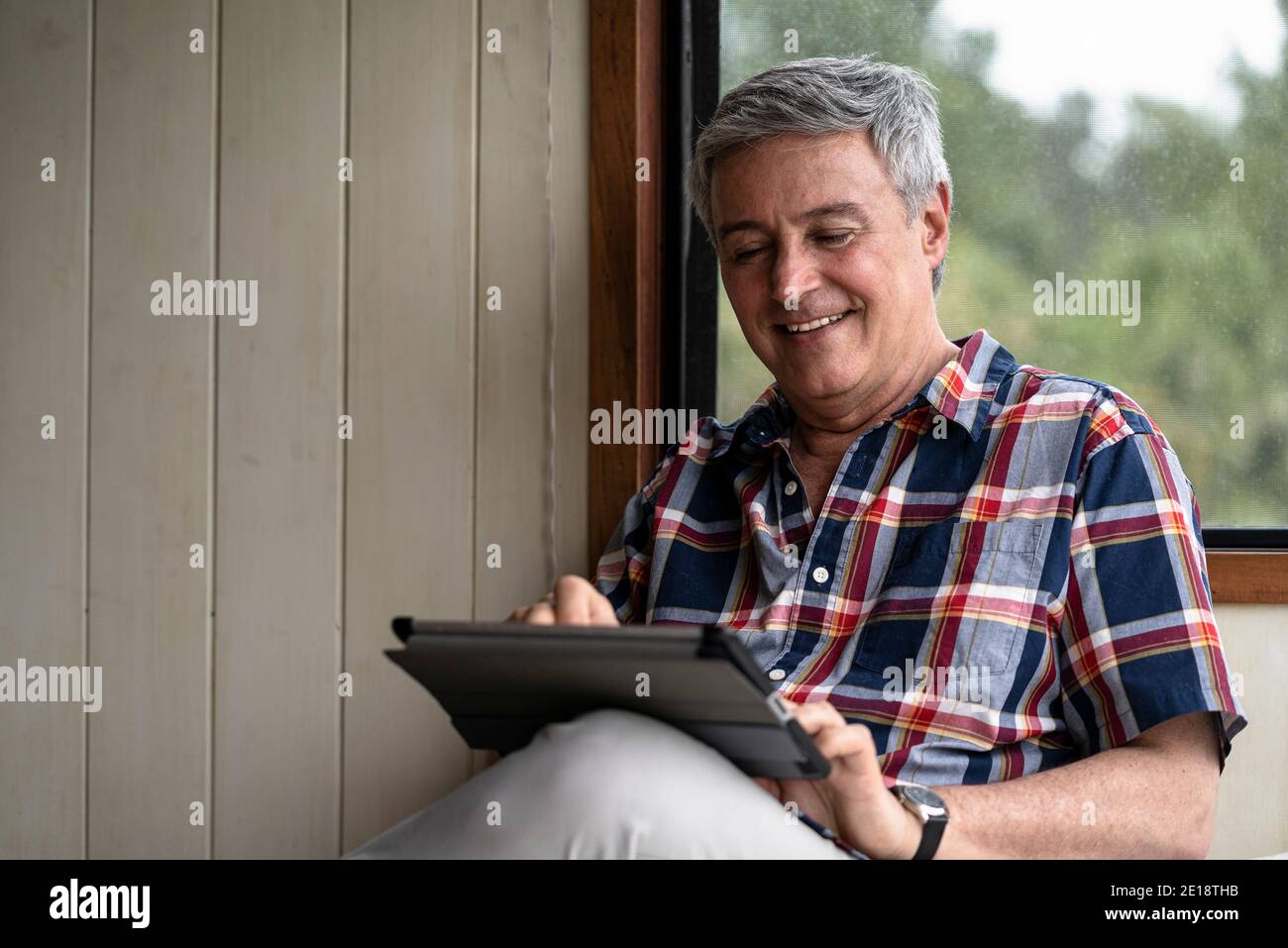 Senior man using digital tablet Stock Photo