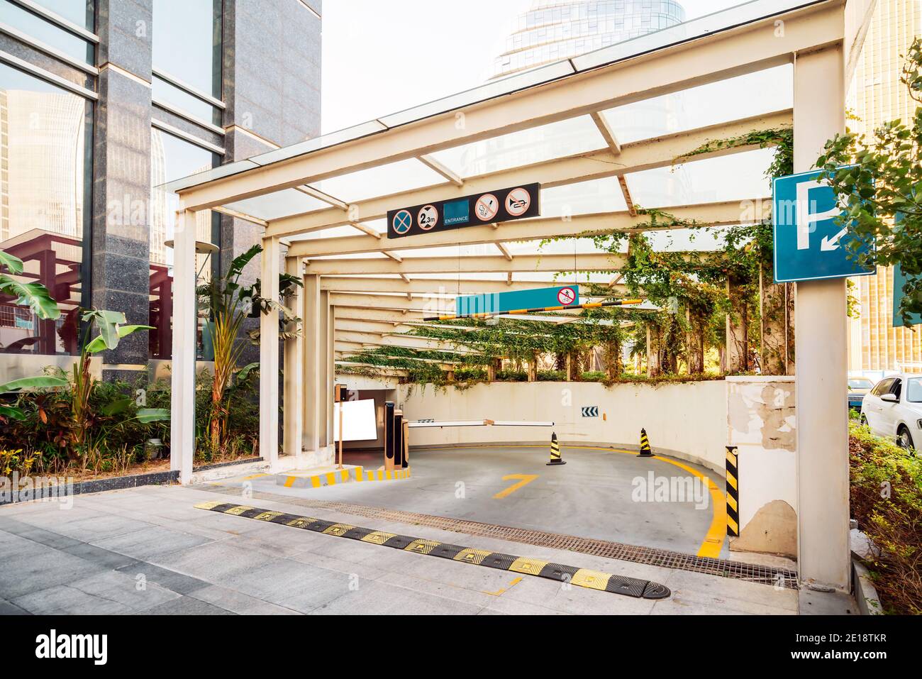 Entrance of modern building and underground parking lot Stock Photo - Alamy
