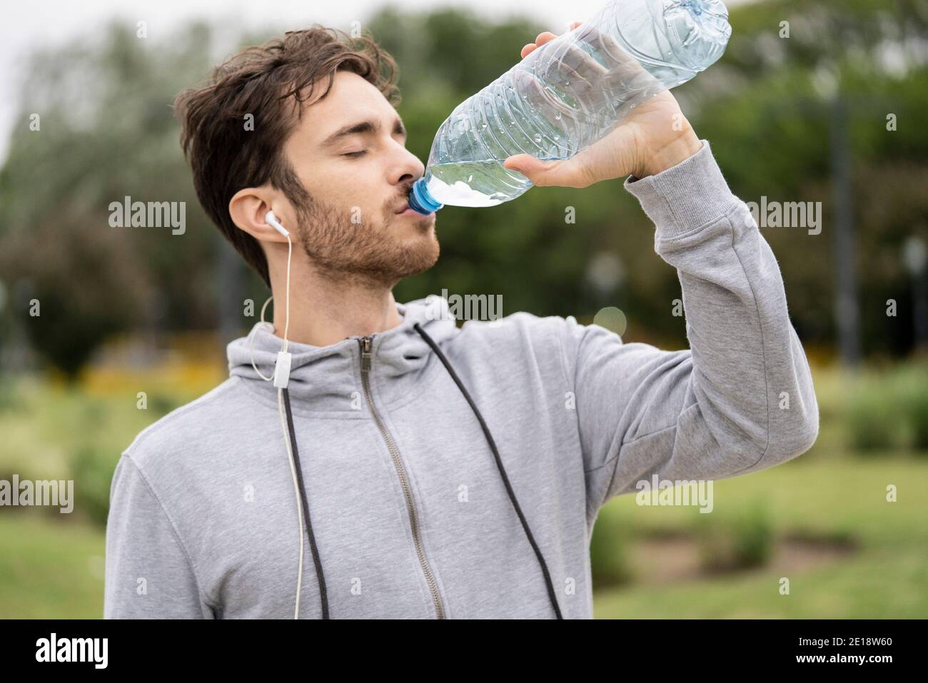 young-man-drinking-water-stock-photo-alamy
