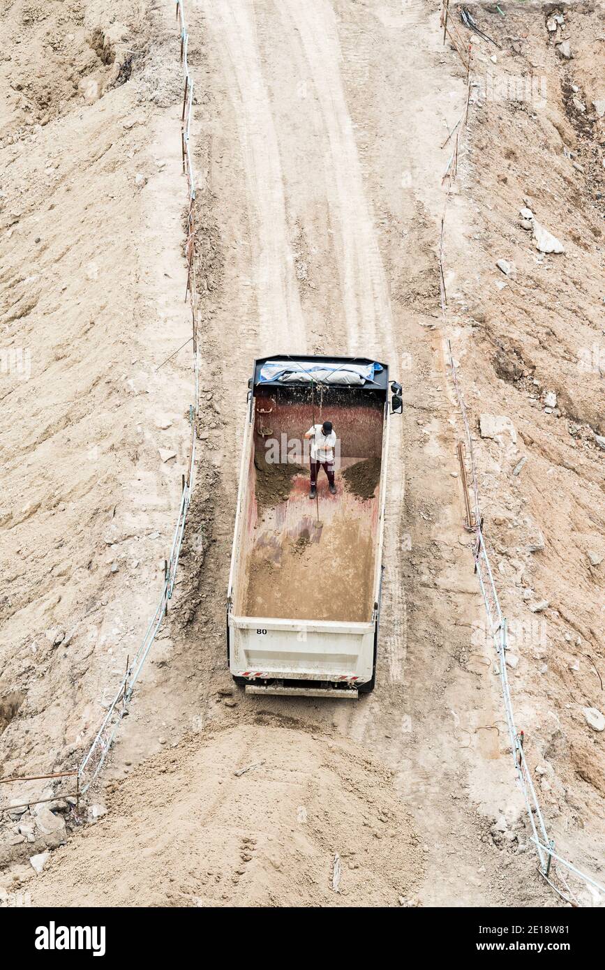 Construction worker working in dumper truck Stock Photo
