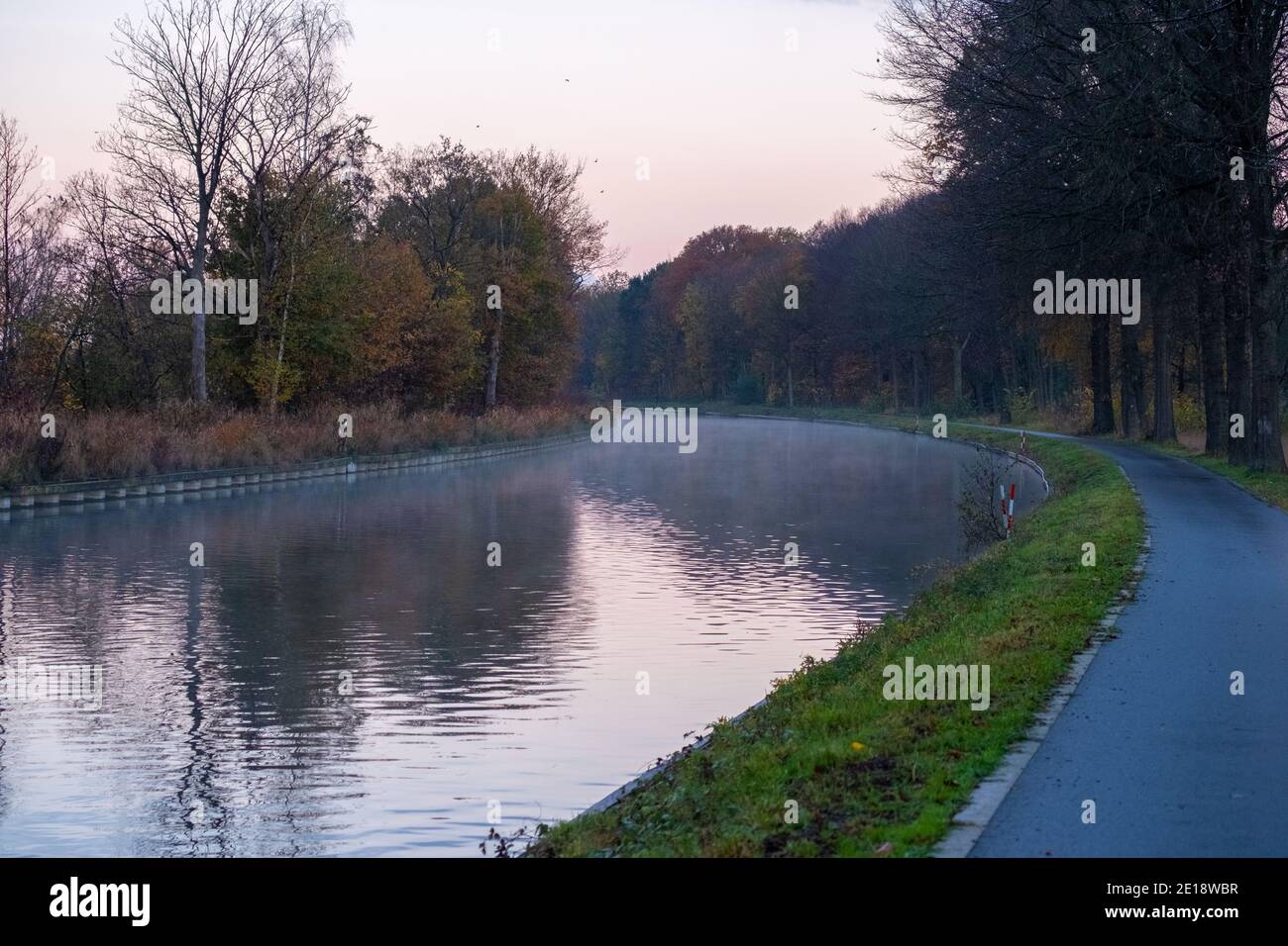 Natural Stream Canals River stream canal bending with grass banks and wild flowers and trees ...