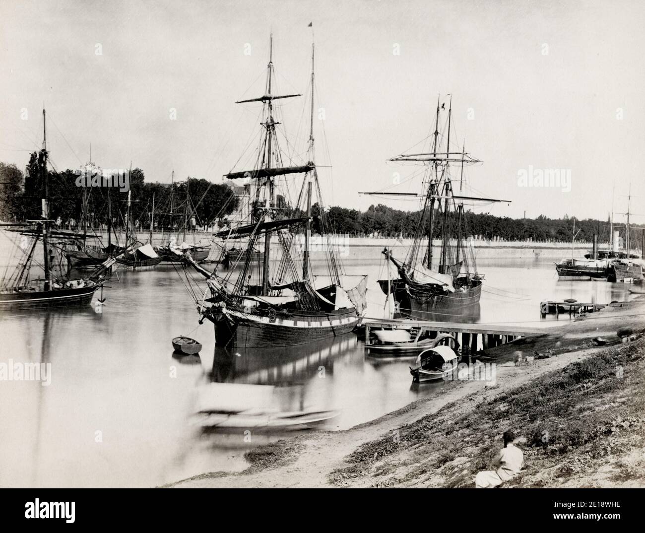 Vintage 19th century photograph - ships tied up along the river, Seville, Spain Stock Photo