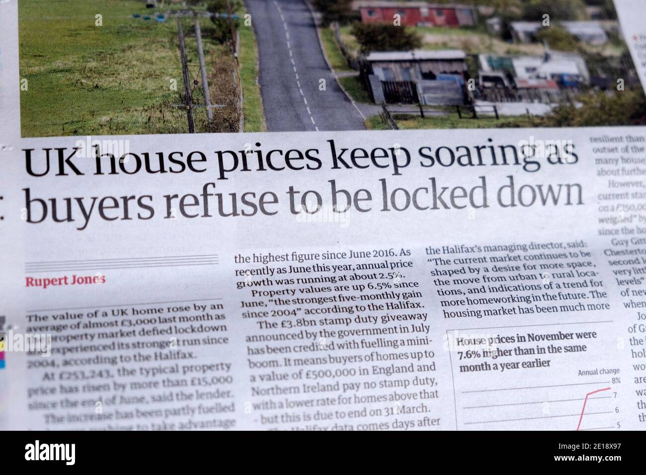 'UK house prices keep soaring as buyers refuse to be locked down' Guardian newspaper headline article inside page on 8 December 2020 in London UK Stock Photo