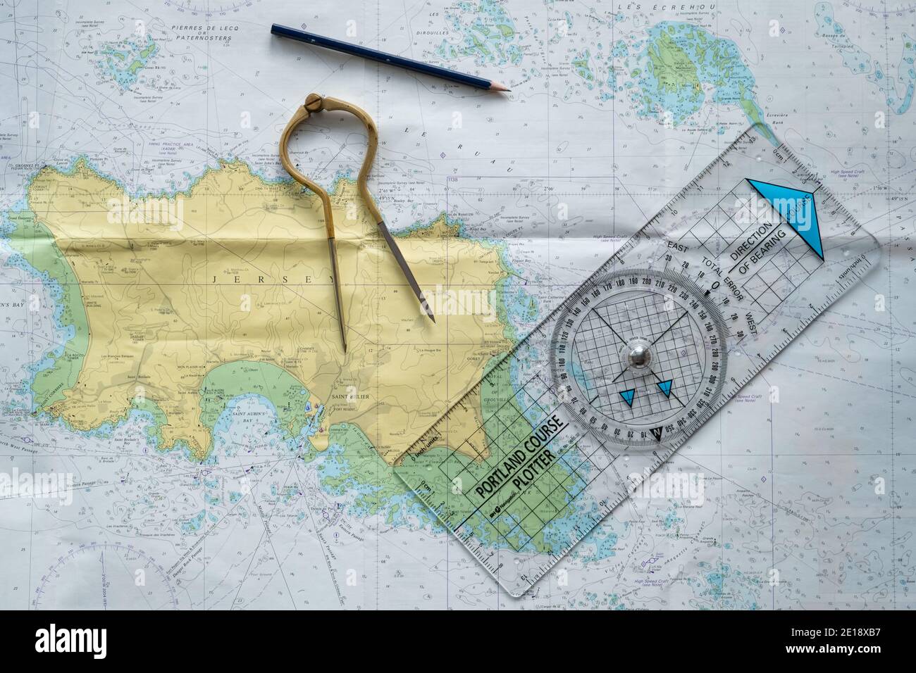 Sea chart, Jersey, Channel Islands, with course plotting tools. Compass, Protractor, Plotter, Pencil. Stock Photo