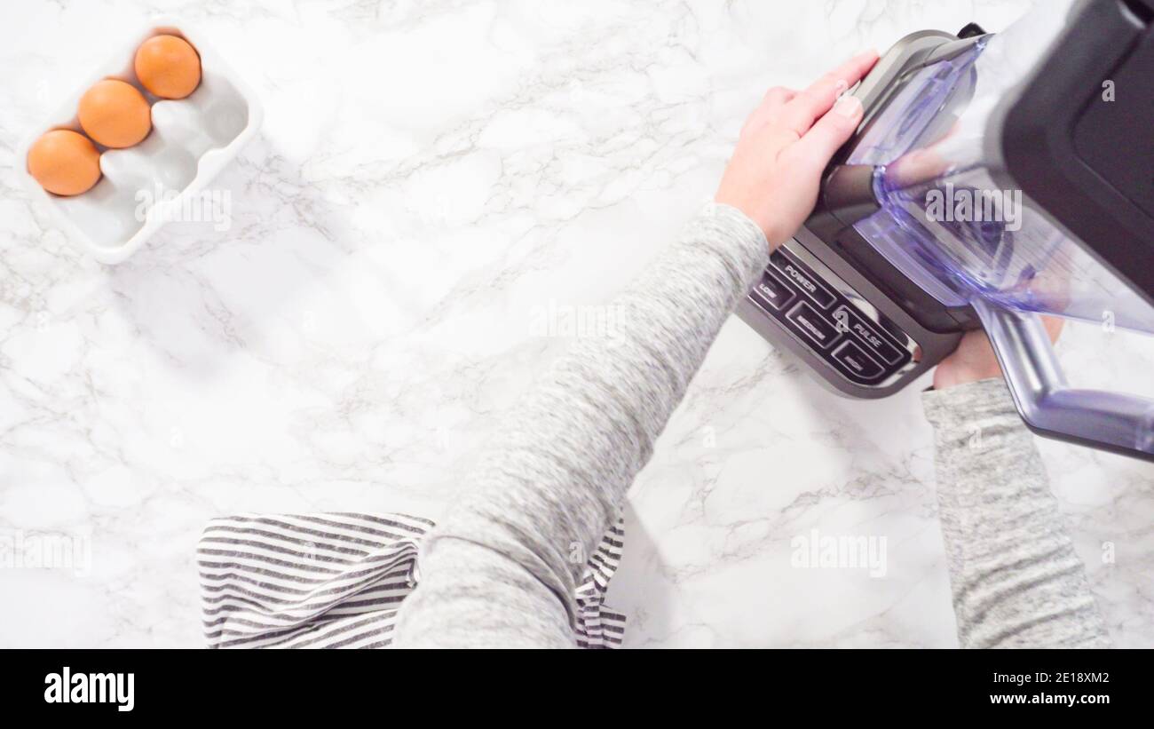 Flat lay. Mixing ingredient in an electric blender to make the crepes