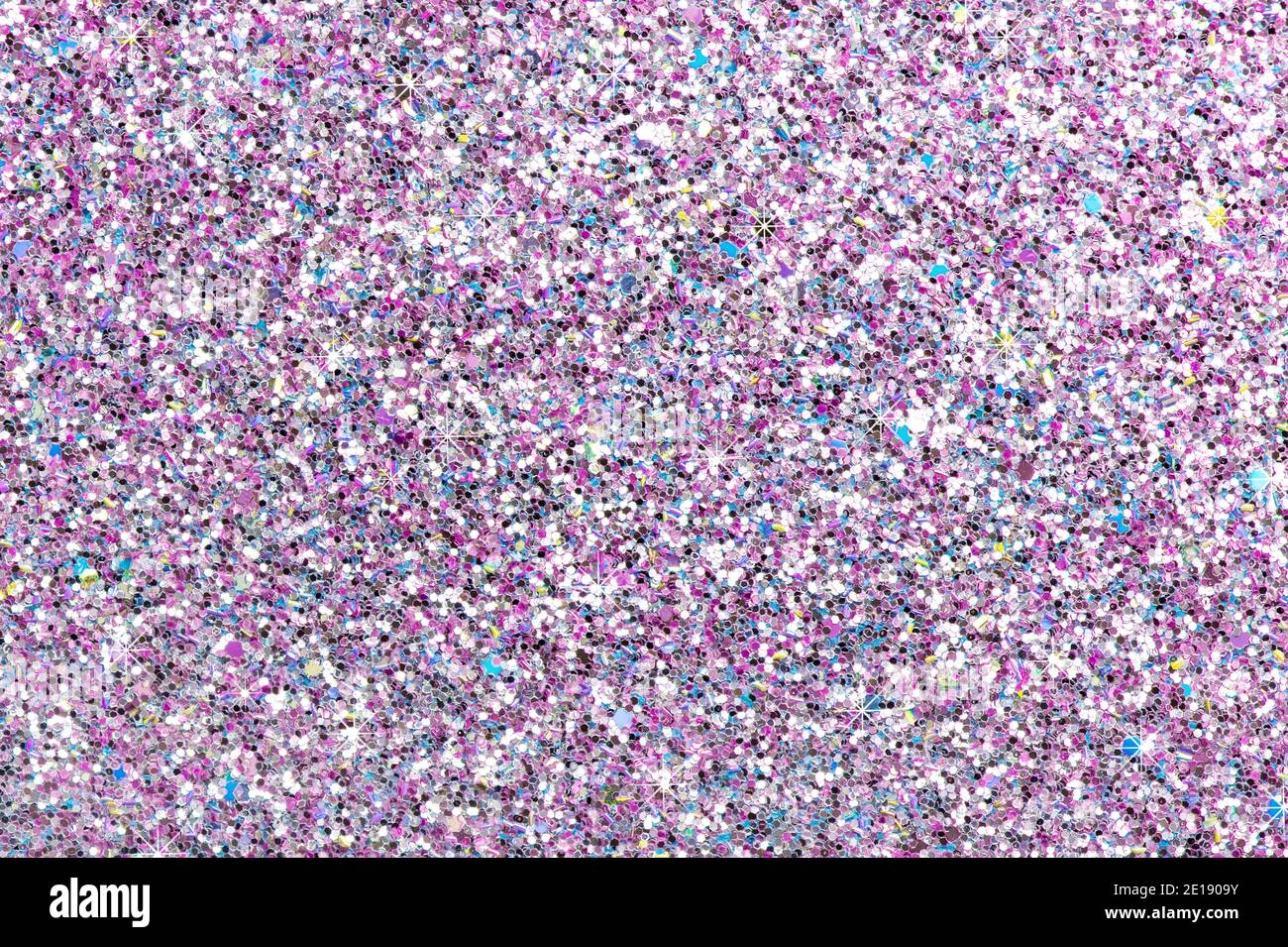 Glitter texture with shining glimmer. Festive background Stock Photo