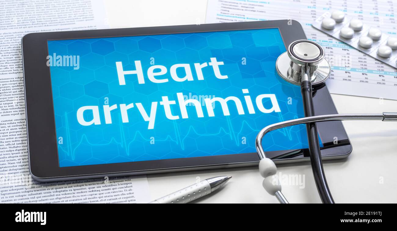 The word Heart arrythmia on the display of a tablet Stock Photo