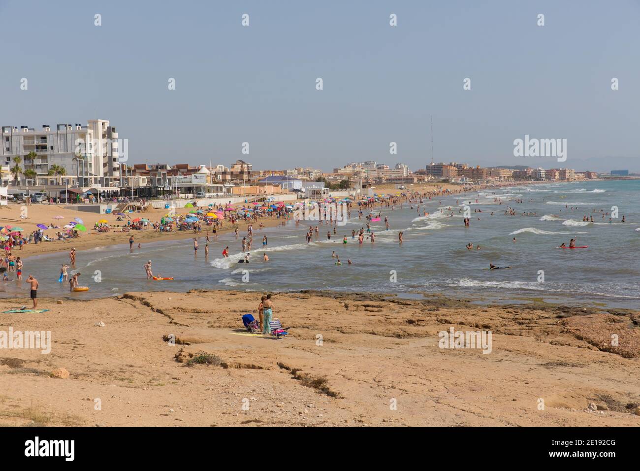Costa Blanca beach busy with holidaymakers in beautiful summer sunshine