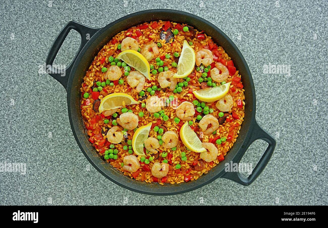 Paella is a Spanish rice dish originally from Valencia. Paella is one