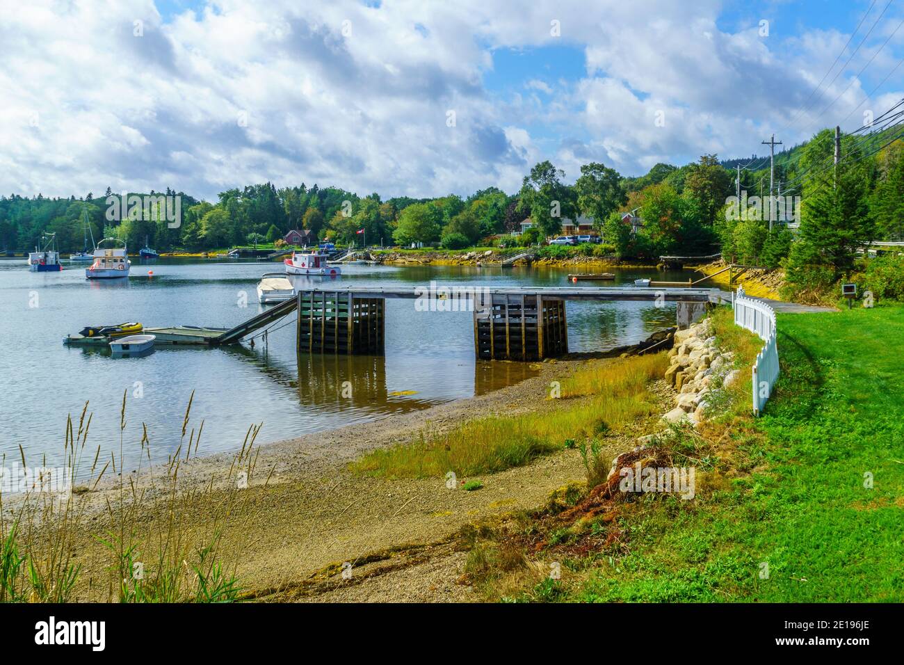 Views of the bay, boats and waterfront buildings in Head of Saints
