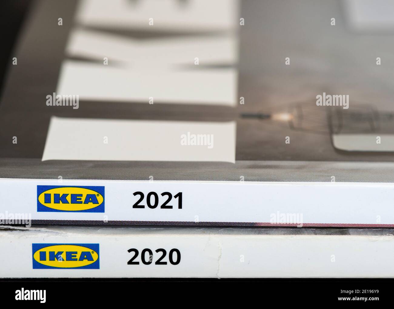 Close up of IKEA 2020 old and IKEA 2021 new edition paper catalogues as the last published printed version by the Swedish furniture retailer Stock Photo