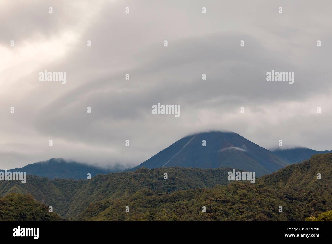 Lenticular cloud over Reventador Volcano , November 2015. Situated in a remote region of the Ecuadorian Amazon.It has been erupting since 2002. Stock Photo