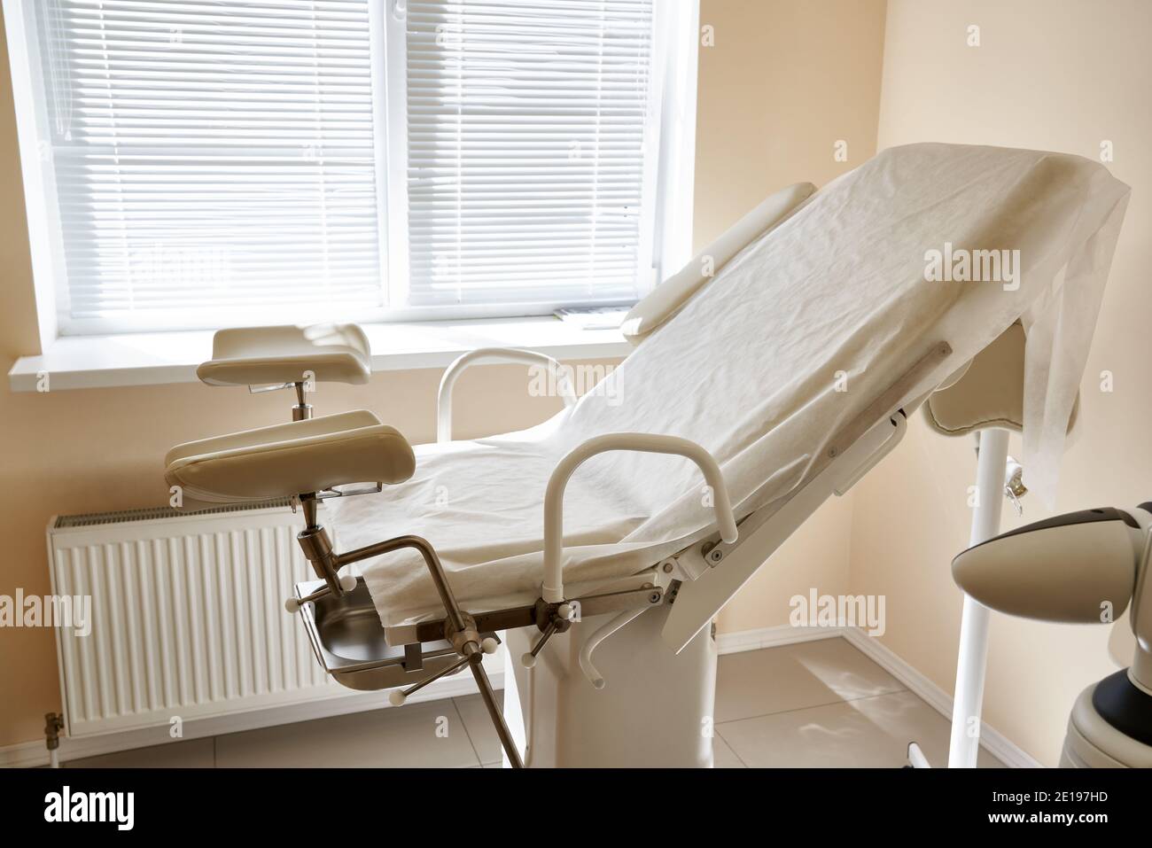 Gynecological chair in the clinic. gynecology room, medical instruments