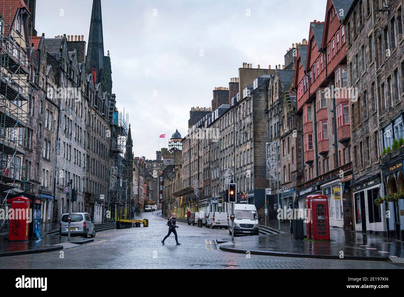 Edinburgh, Scotland, UK. 5 January 2021. Views of a virtually deserted Edinburgh City Centre as Scotland wakes up to the first day of a new strict national lockdown announced by Scottish Government to contain new upsurge in Covid-19 infections. Pic; The Royal Mile in the Old town is almost deserted with no tourists evident.   Iain Masterton/Alamy Live News Stock Photo