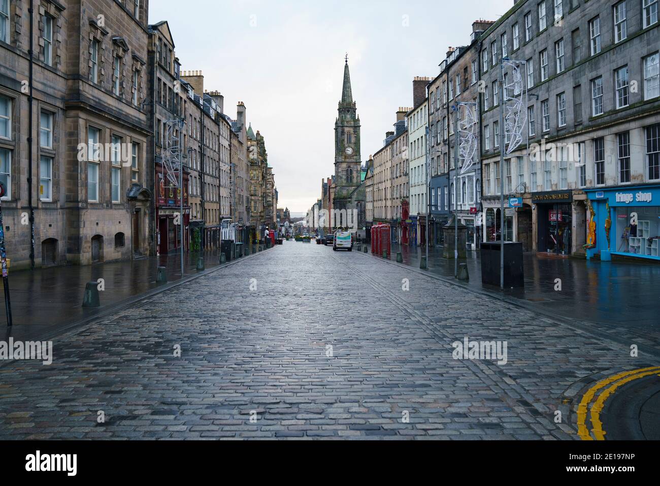 Edinburgh, Scotland, UK. 5 January 2021. Views of a virtually deserted Edinburgh City Centre as Scotland wakes up to the first day of a new strict national lockdown announced by Scottish Government to contain new upsurge in Covid-19 infections. Pic; The Royal Mile in the Old town is almost deserted with no tourists evident.   Iain Masterton/Alamy Live News Stock Photo