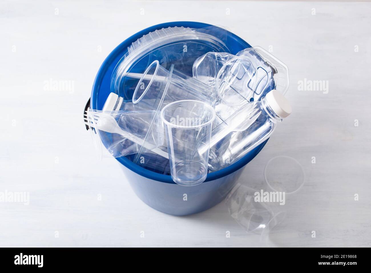clean recyclable plastic bottles, containers, cups in garbage bin