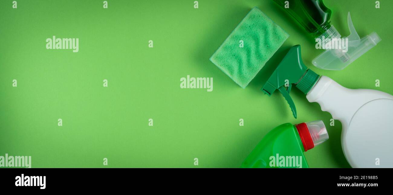 Cleaning supplies on green background Stock Photo