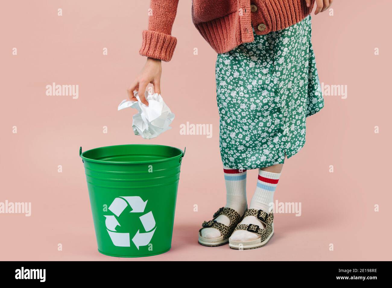 Girl is throwing crumpled paper in recycling bin Stock Photo Alamy
