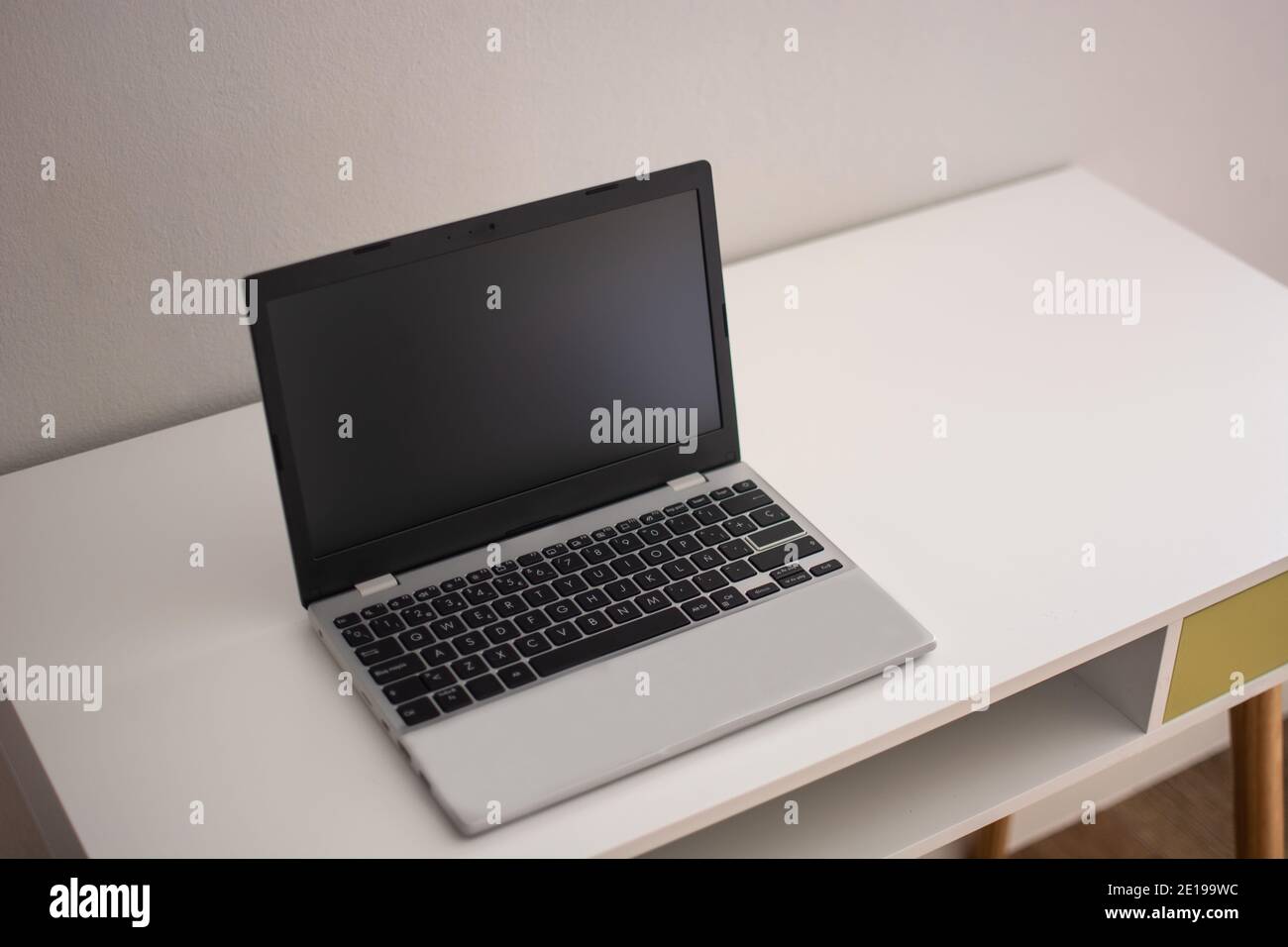 Modern workspace with laptop on desk Stock Photo
