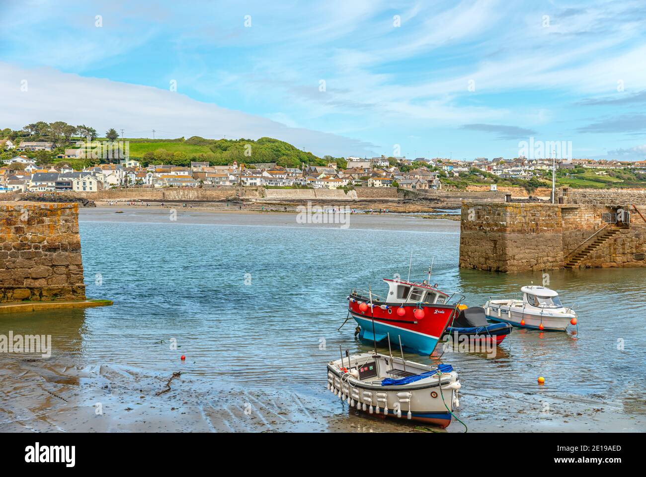 Fishing Harbor of St Michaels Mount with Marazion in the background, Cornwall, England Stock Photo