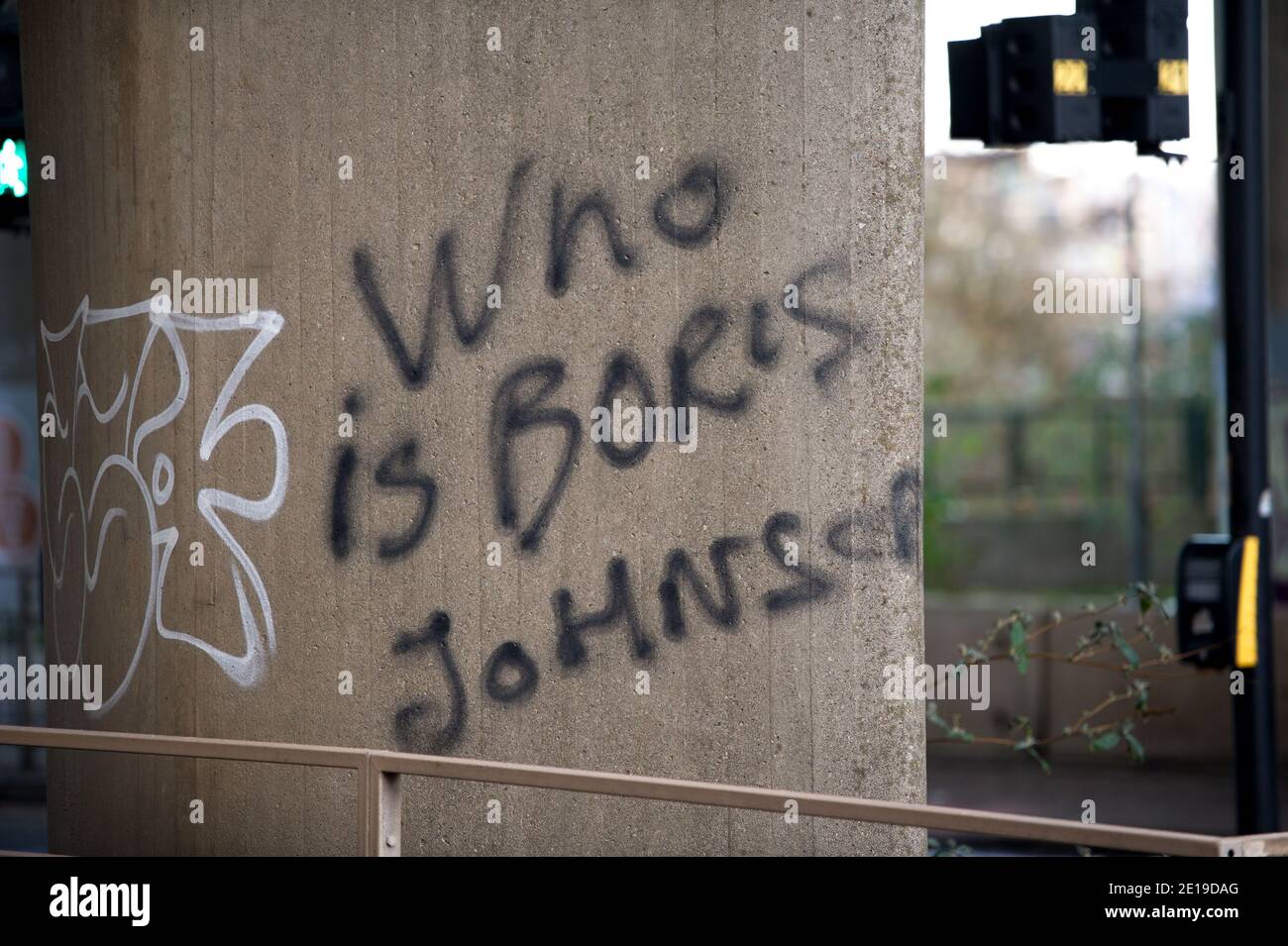 Glasgow, Scotland, UK. 5th Jan, 2021. Pictured: Either somebody has been living in a cave for a while or they are trying to make a point, their graffiti on the Kingston Bridge, “WHO IS Boris Johnson”. As of 00:01 this morning Scotland has been placed into another lockdown as per the Scottish First Minister's address at 2pm yesterday. Only essential travel is allowed such as going to work and essential food shopping and exercise, other than that everyone must stay in their homes. Credit: Colin Fisher/Alamy Live News Stock Photo