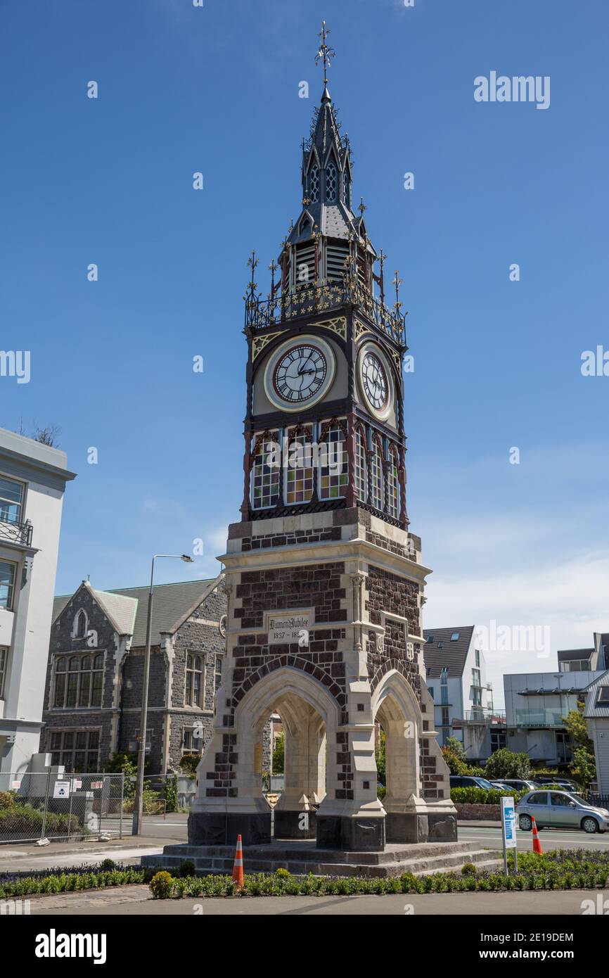 Clocktower in Christchurch New Zealand. Temporary fencing and hazard cones remain as warnings of instability following the 2010 earthquakes Stock Photo