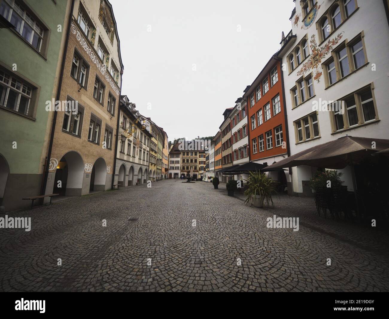 Panoramic view of historic traditional buildings in empty cobblestone streets of Feldkirch Vorarlberg Austria alps mountains Europe Stock Photo