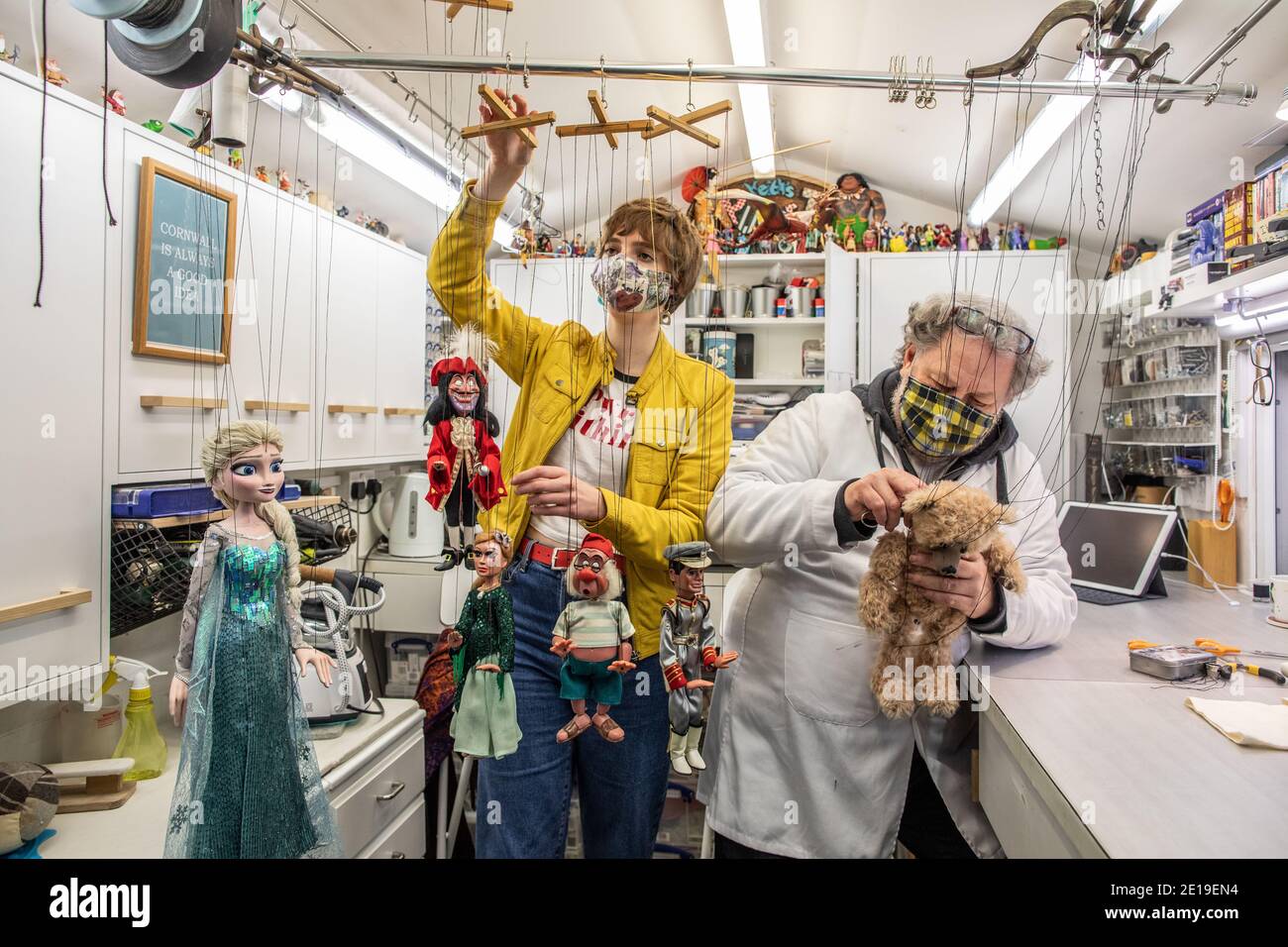 Puppet costume maker and designer Keith Frederick works alongside Alicia Britt, puppet maker, at his workshop in London, England, United Kingdom Stock Photo