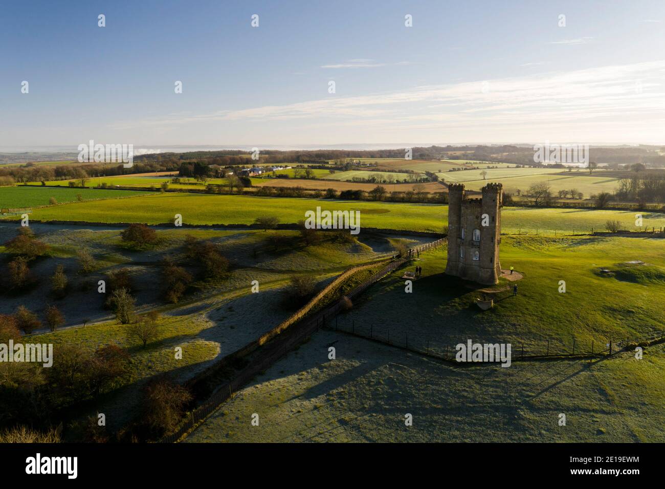 Aerial drone photo of Broadway Tower, a famous old building landmark in The Cotswolds Hills, iconic English tourist attraction in beautiful British countryside with green fields, Gloucestershire, England, UK Stock Photo