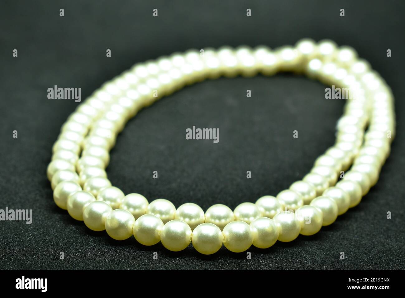 pearl necklace arranging on black background Stock Photo