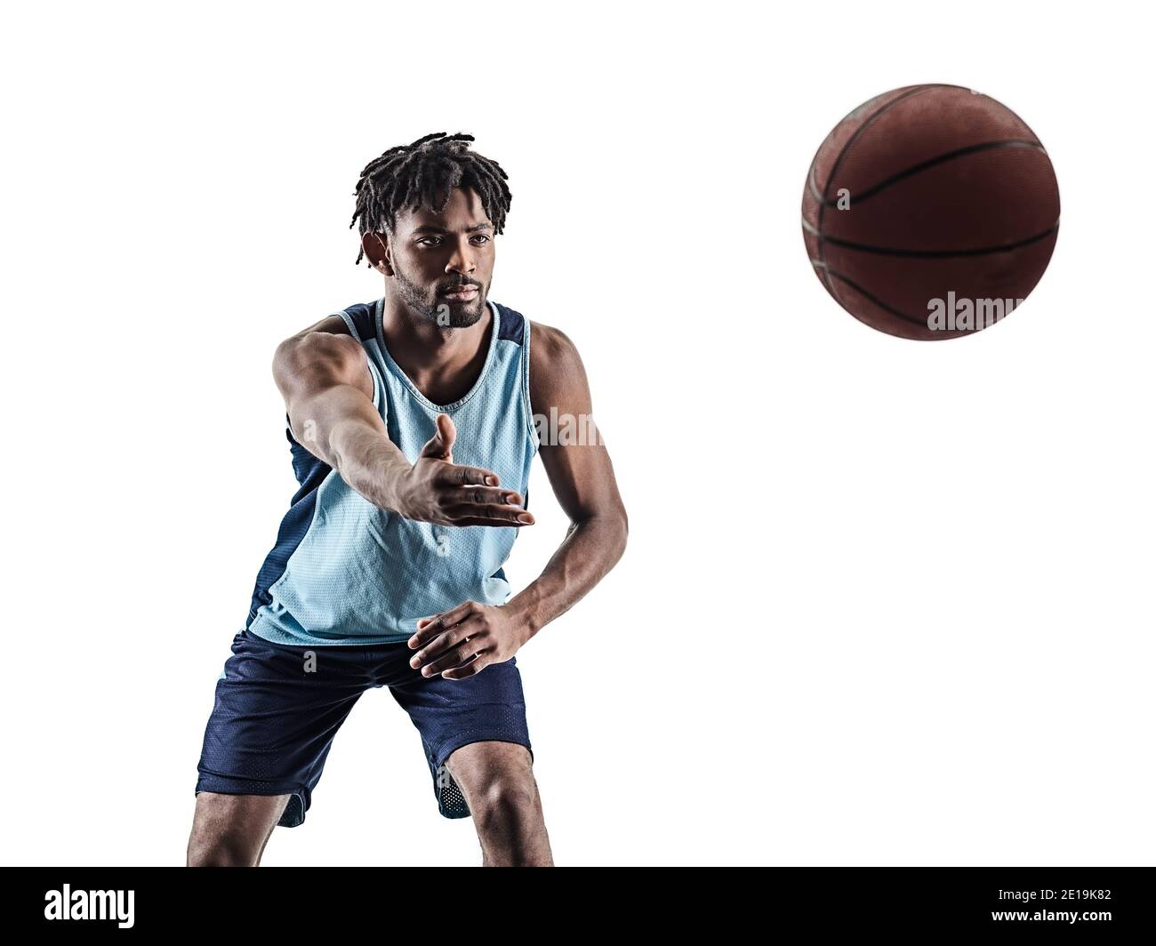 one afro-american african basketball player man isolated in silhouette shadow on white background Stock Photo