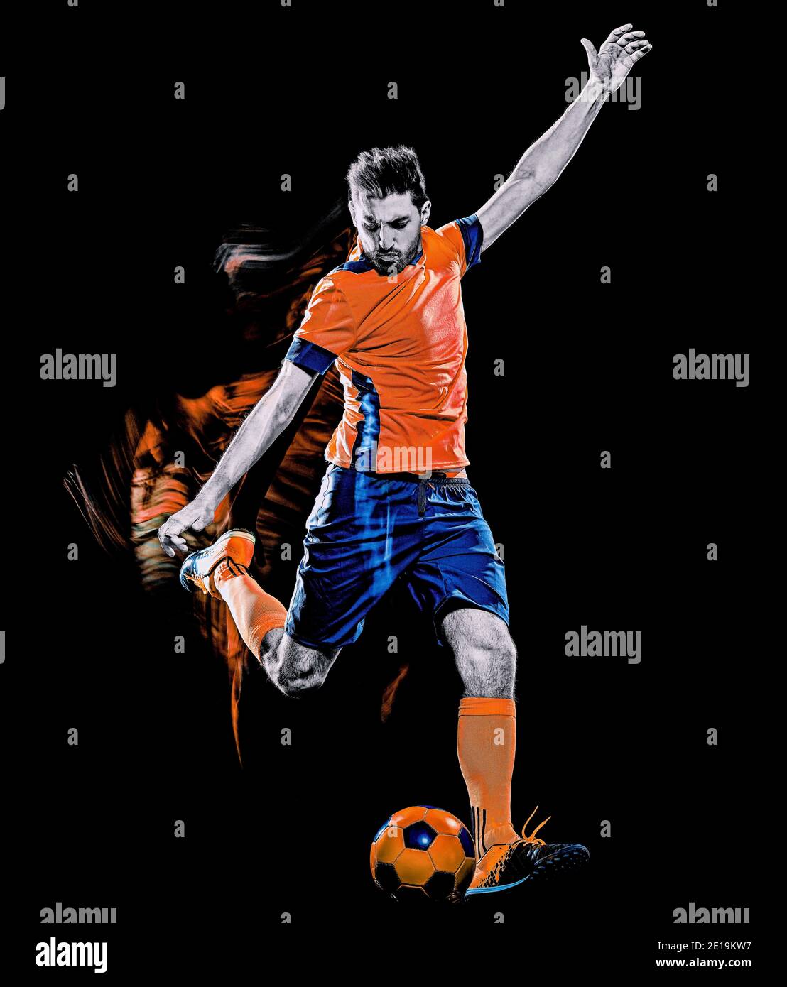 one caucasian soccer player man isolated on black background with light painting speed effect Stock Photo
