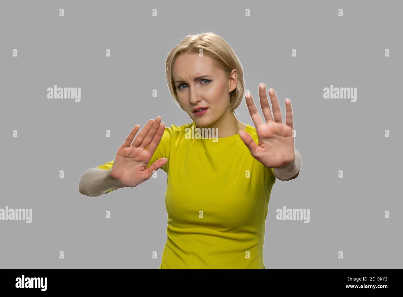 Young caucasian woman showing rejection sign. Stock Photo