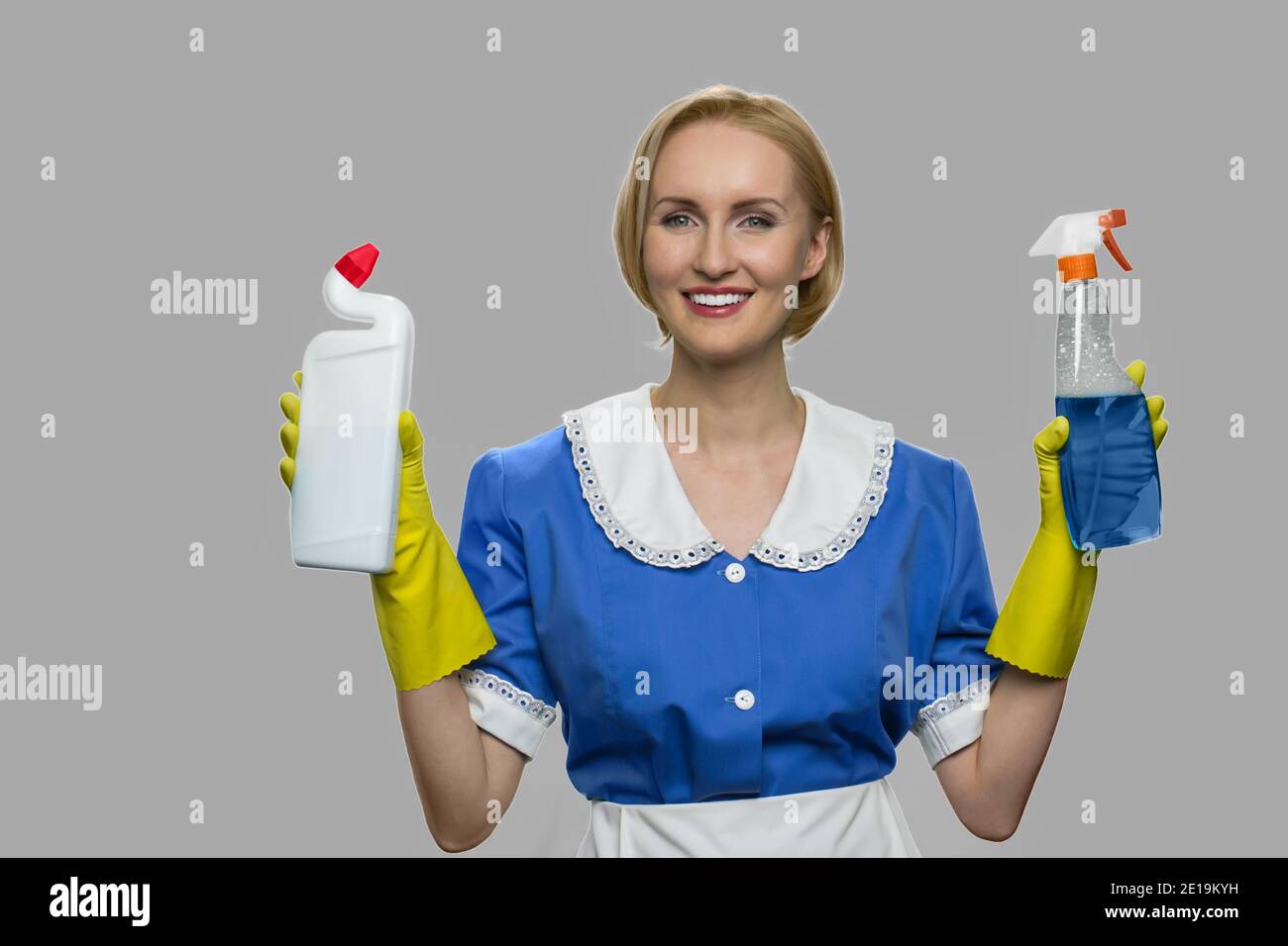 Beautiful young house maid looking at camera Stock Photo - Alamy