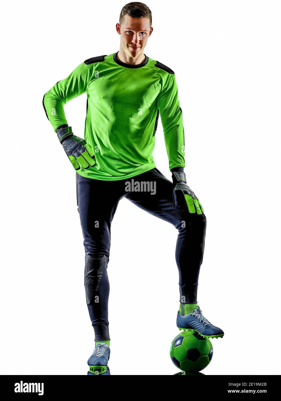 one caucasian soccer player goalkeeper  man in  studio silhouette shadow isolated on white background Stock Photo