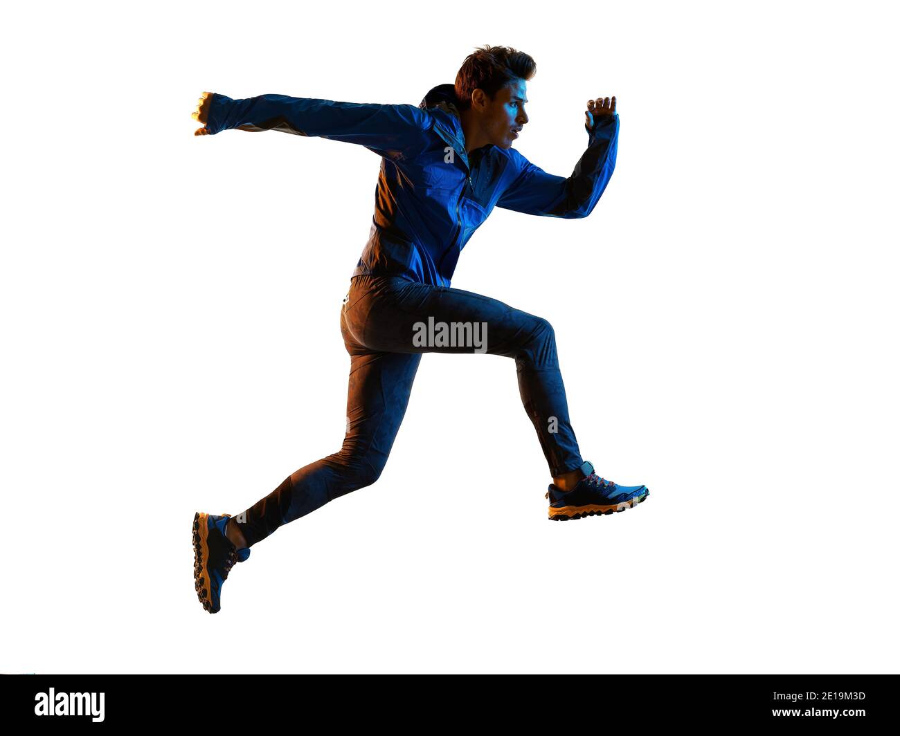 one young caucasian trail cross country runner running man  silhouette shadow  isolated on white background Stock Photo