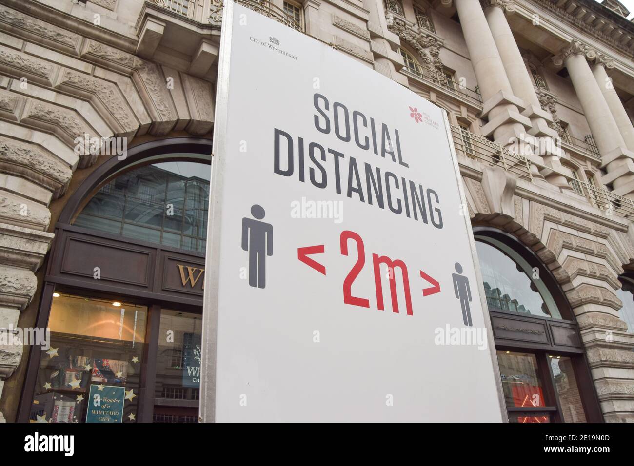 Detail of a social distancing sign on Regent Street in London as England imposes the third national lockdown. Stock Photo