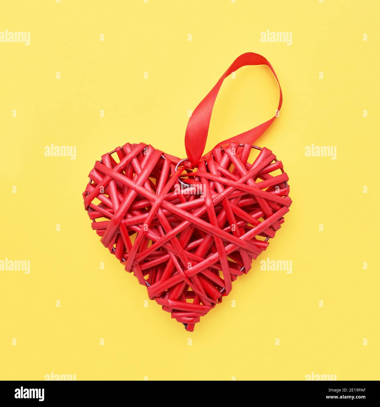 Red heart shaped braided wicker on white background Stock Photo - Alamy