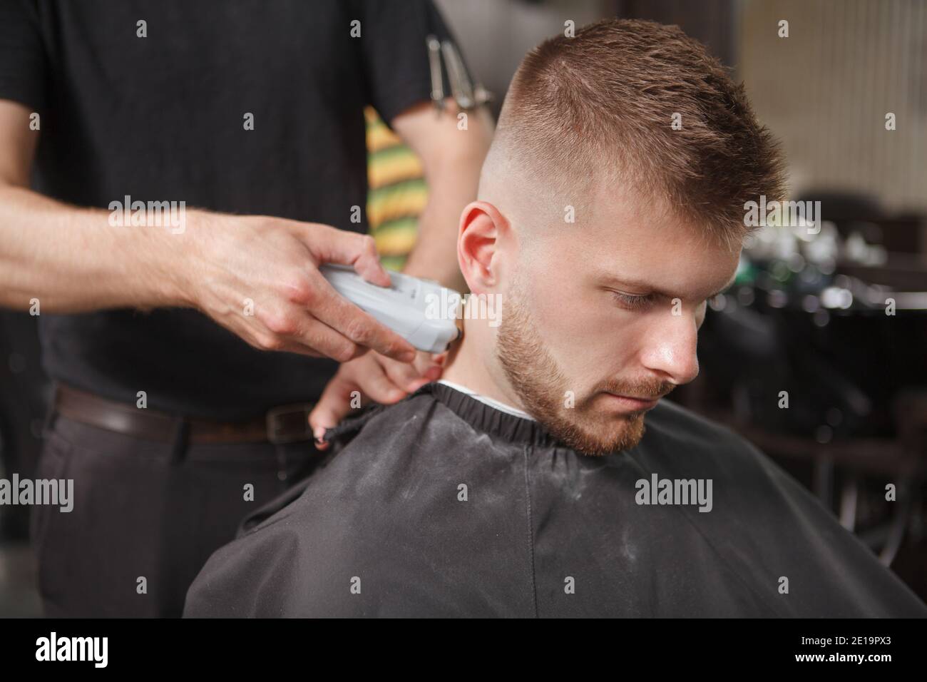 Male client getting new haircut at the barbershop Stock Photo