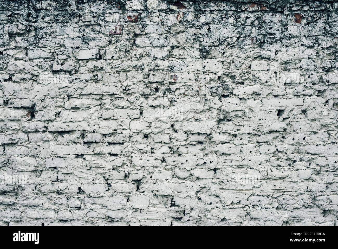 Aged white painted brick wall texture. Old textured grunge wall surface