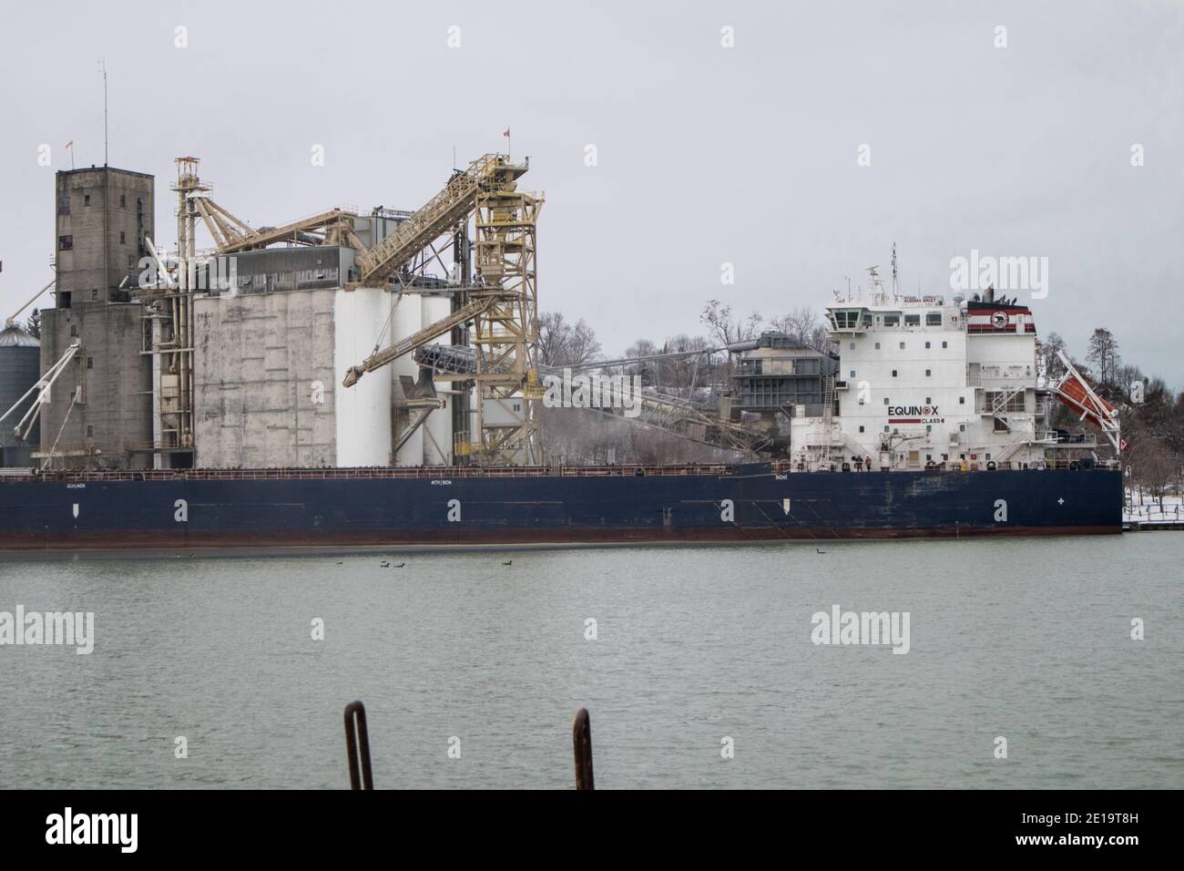 A large ship at the Port of Goderich large industrial facilities. Stock Photo