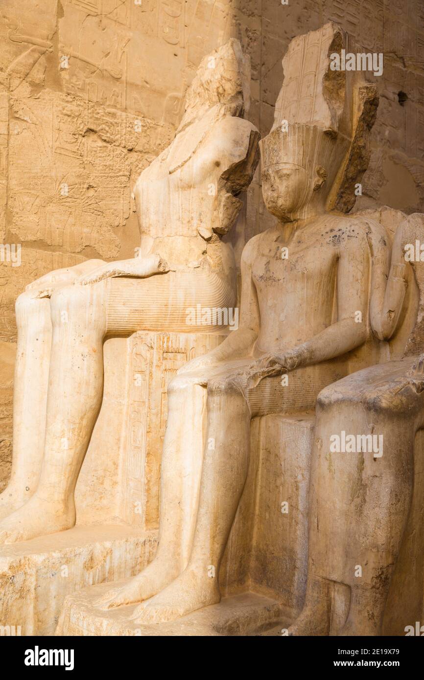 Egypt, Luxor, Luxor Temple, The white limestone double statues of the gods Amun and Mut in the Great Colonnade of Amenophis 111 Stock Photo