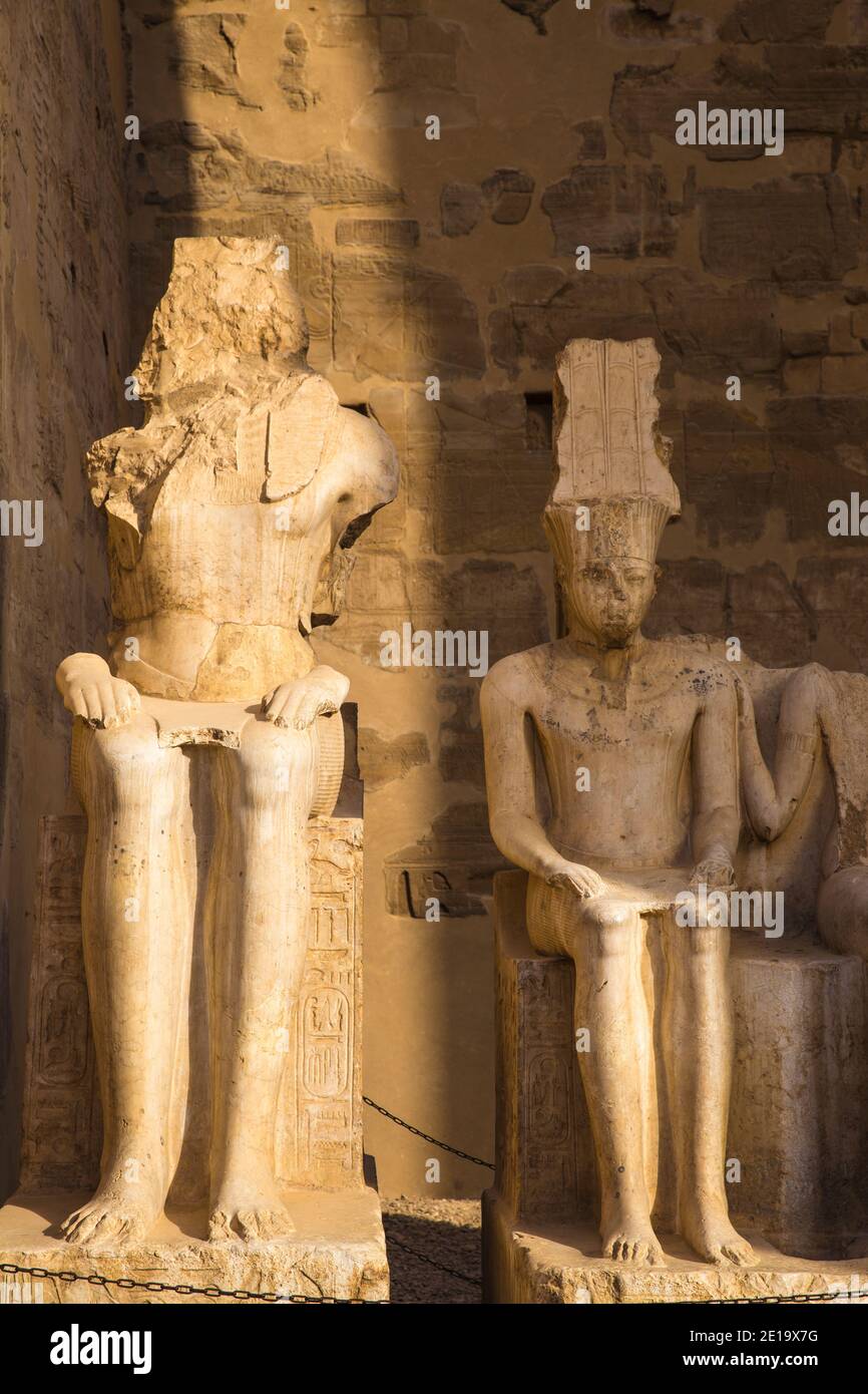 Egypt, Luxor, Luxor Temple, The white limestone double statues of the gods Amun and Mut in the Great Colonnade of Amenophis 111 Stock Photo
