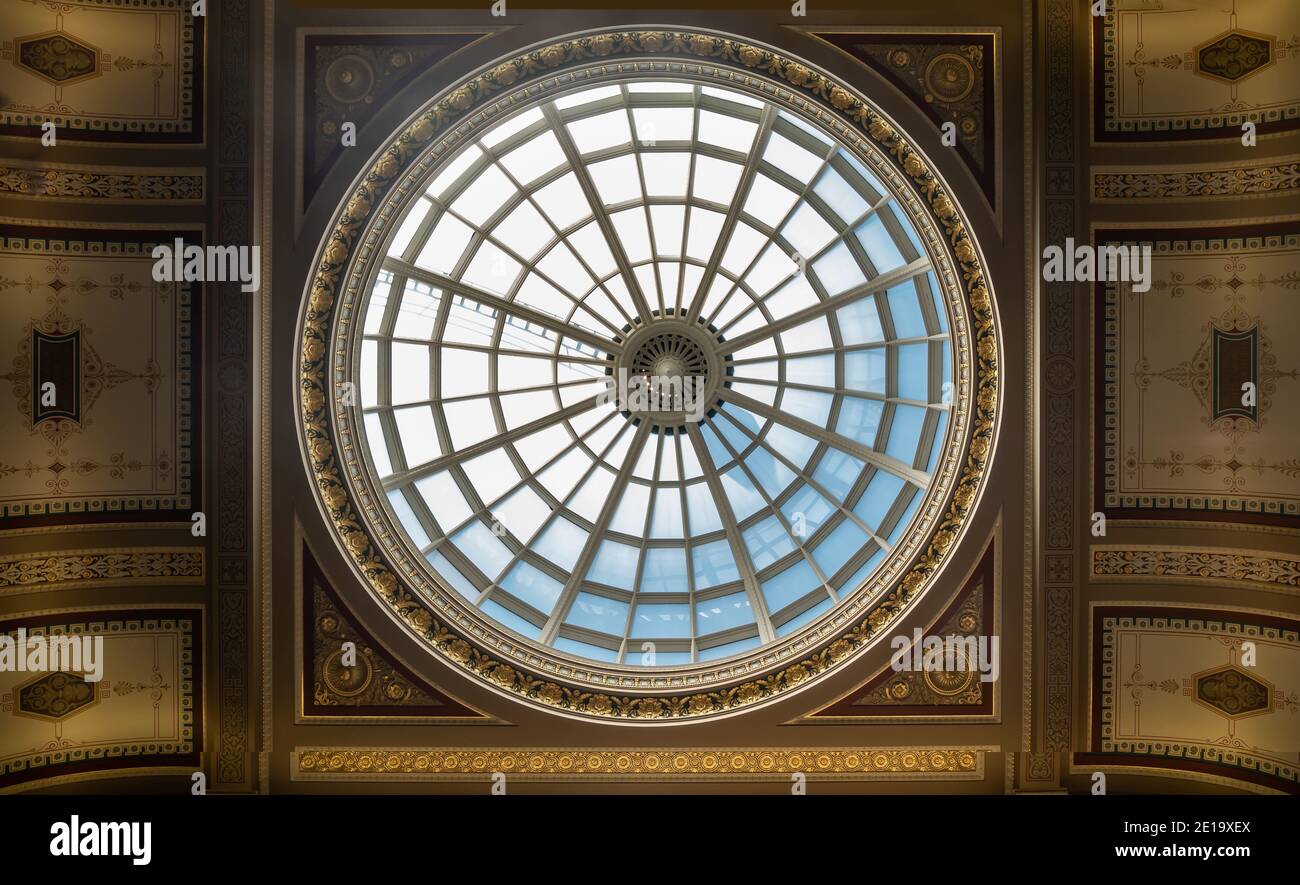 London, Enland - Apr 20, 2019 : Light passes through The high ceiling glass dome inside main lobby of The National Gallery is an art museum in Trafalg Stock Photo