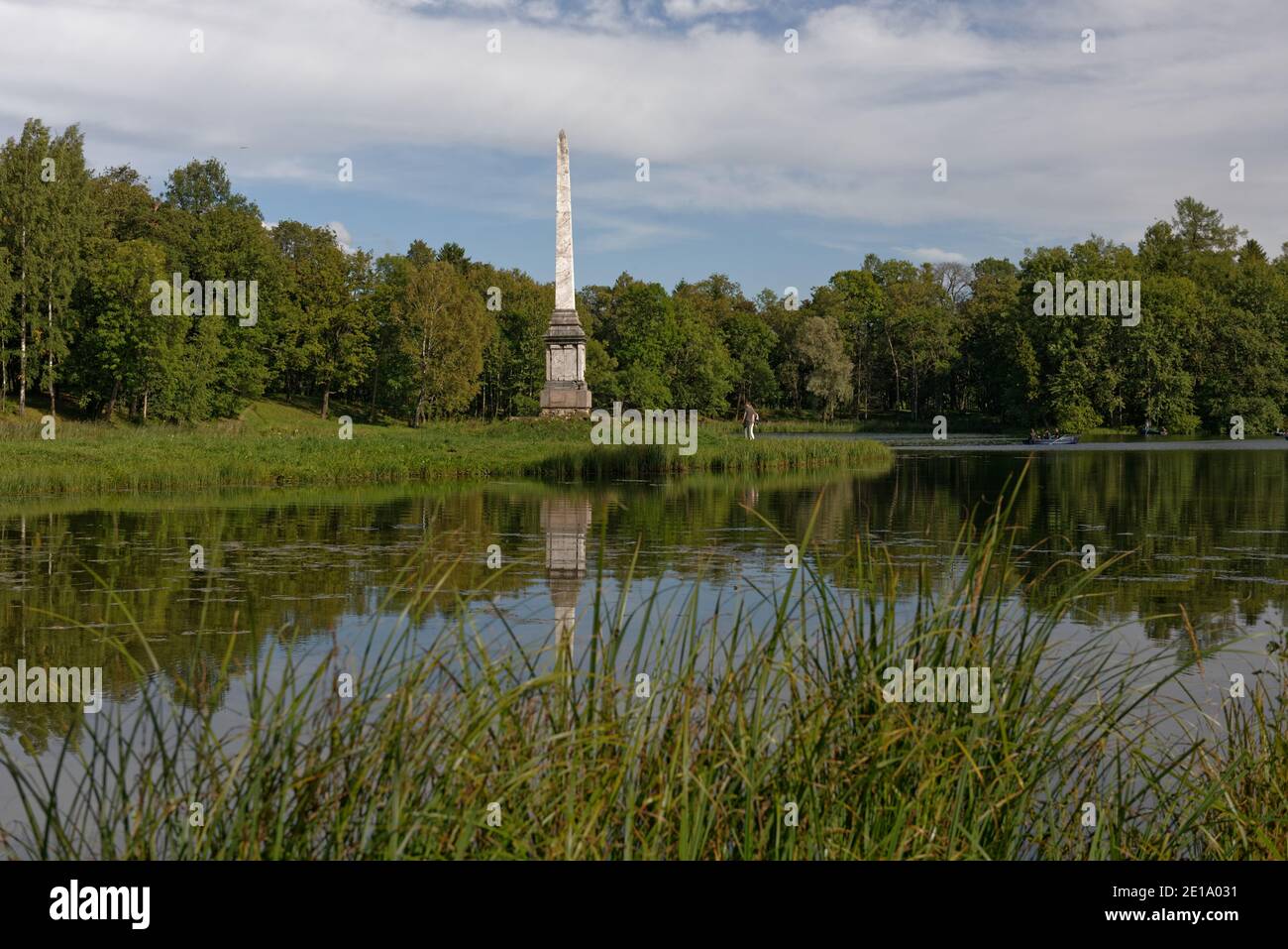 Cesme obelisk on the shore of lake Beloye in the park of Gatchina palace, Gatchina near St. Petersburg, Russia Stock Photo