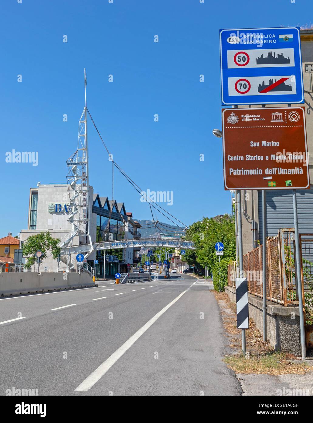 Dogana, San Marino - June 16, 2019: Spire Sign and Pedestrian Bridge at Entrance in Republic of San Marino. Stock Photo
