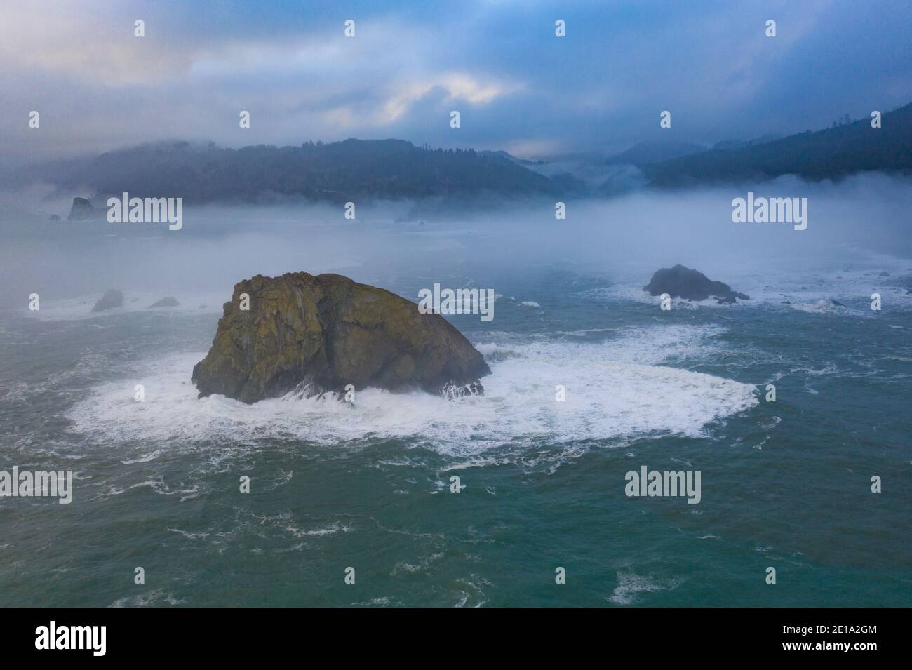 The marine layer drifts over the coastline of Northern California in Klamath. This region is home to the world's most beautiful temperate forests. Stock Photo
