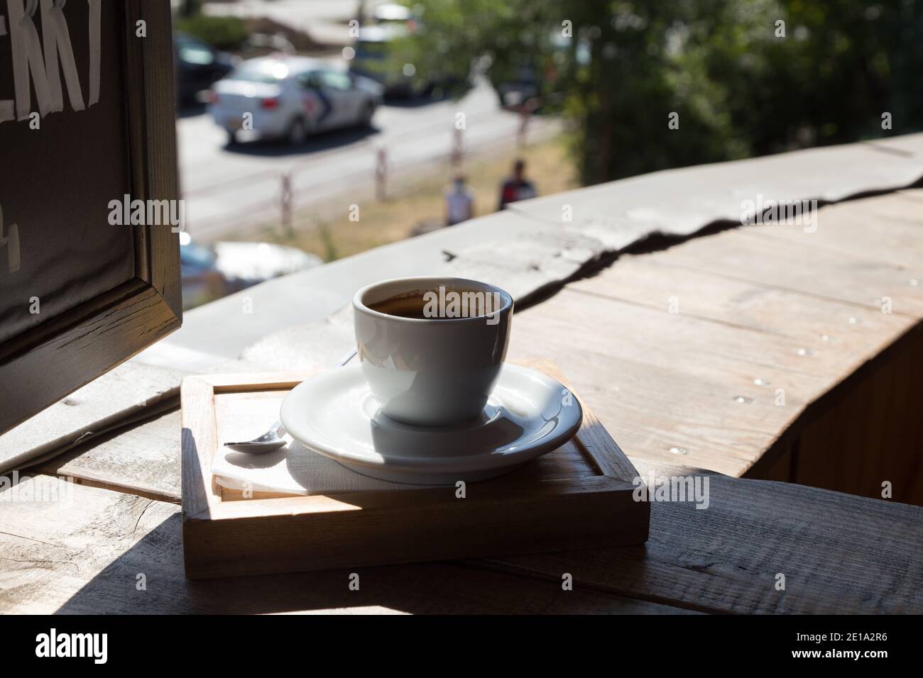 Cup of coffee on a wooden table. Close-up. Stock Photo
