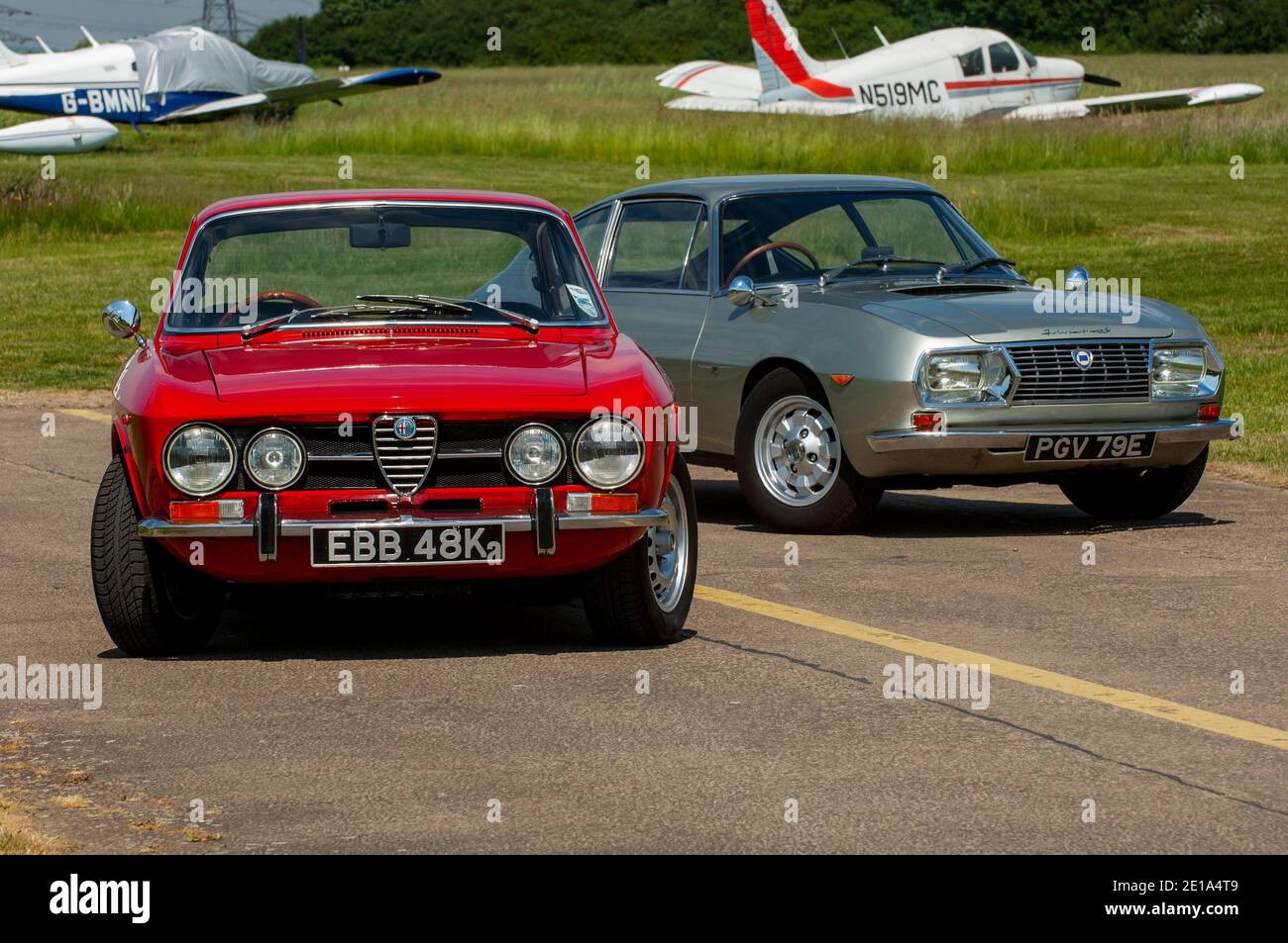 Alfa GT Veloce 1750 (Giulia GTV 105 Series) and Lancia Fulvia 1960s Italian sports cars Stock Photo