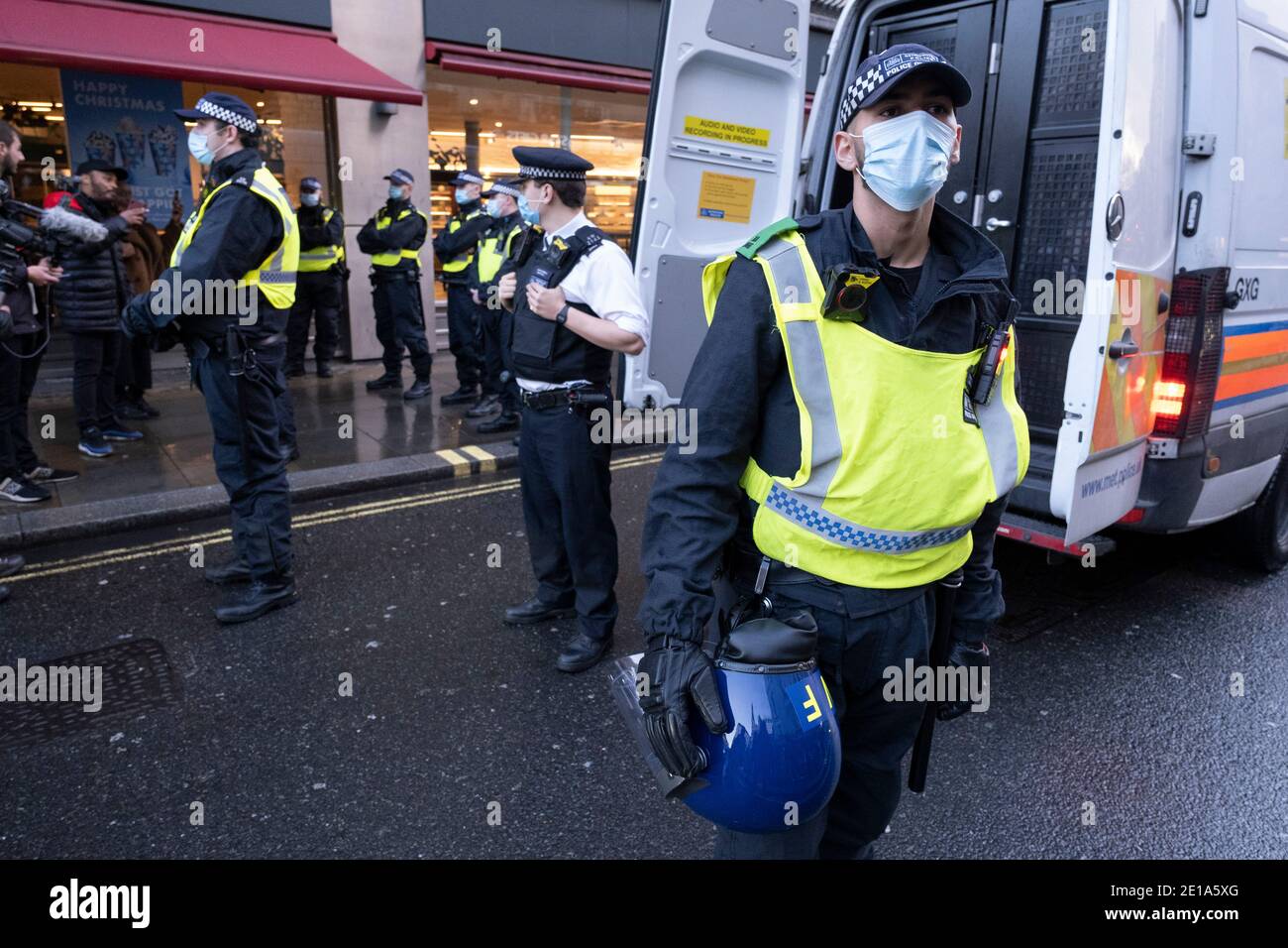 Heavy police presence dealing with anti-vaxxer protesters who had fragmented across the West End as the Prime Minister announces a new tighter fourth tier of local coronavirus restrictions for London and the South East, and that the planned Christmas relaxation of the rules was to be scrapped on 19th December 2020 in London, United Kingdom. Vaccine hesitancy, also known as anti-vaccination or anti-vax, is a reluctance or refusal to be vaccinated or to have ones children vaccinated against contagious diseases despite the availability of vaccination services. Stock Photo